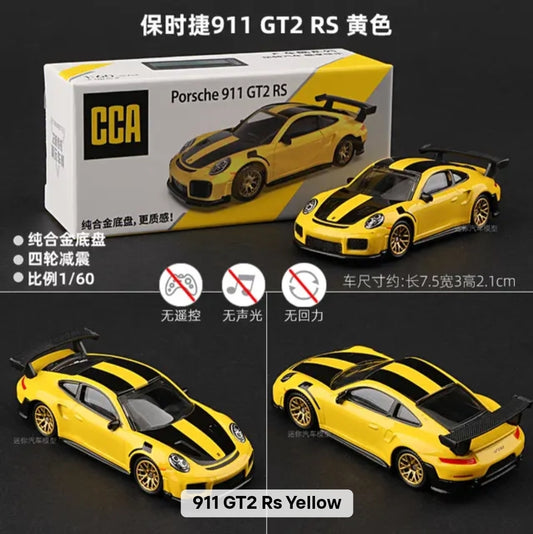 Yellow Porsche 911 GT2 RS model car with packaging and specifications on a black background